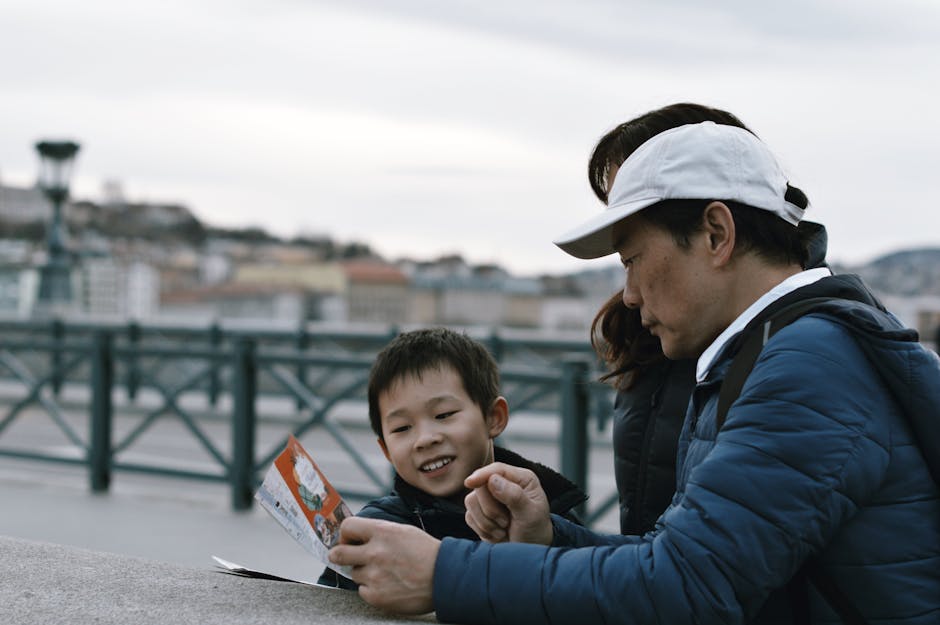 Family enjoys a sightseeing trip in an urban environment on a cloudy day, browsing a city map.